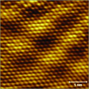 An atomic resolution scanning tunnelling microscope image of a bilayer of graphene epitaxially grown on a SiC-on-silicon film. Credit: B. Gupta and N. Motta, QUT.